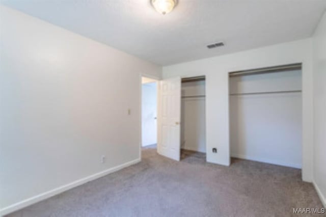 4230 Knollgate Rd, Montgomery, AL 36116 - unfurnished bedroom with two closets and carpet flooring