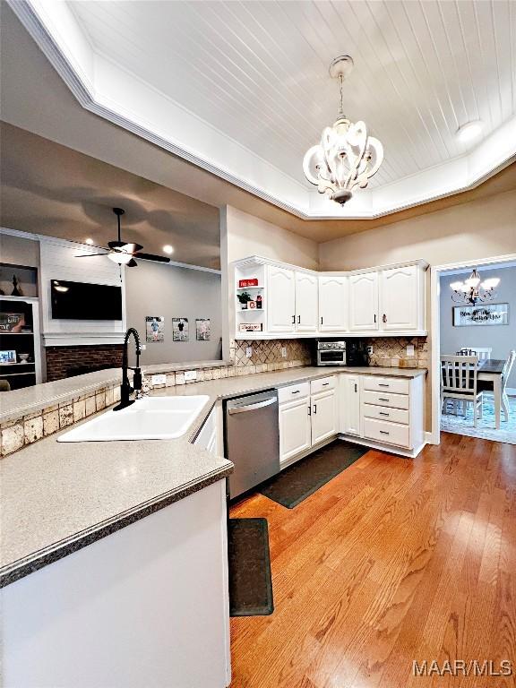 267 River Birch Cir, Wetumpka, AL 36093 - kitchen with a chandelier, dishwasher, white cabinetry, wood finished floors, and tasteful backsplash