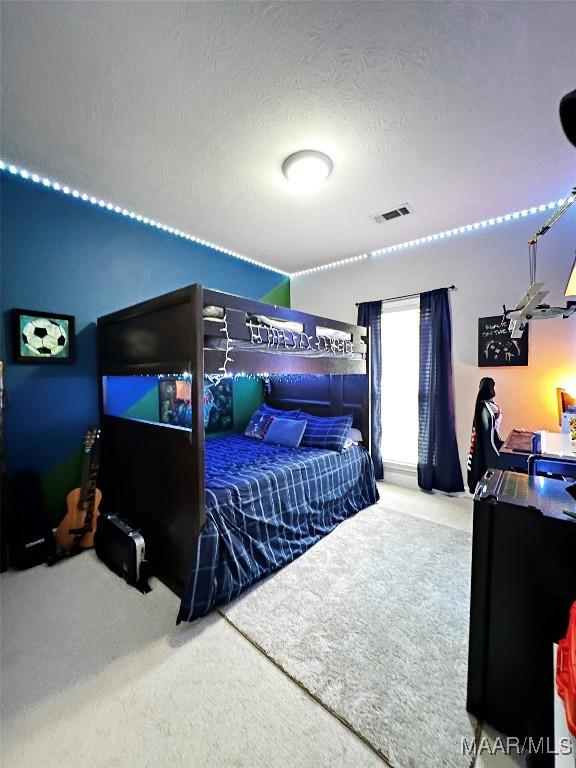 267 River Birch Cir, Wetumpka, AL 36093 - bedroom with carpet and a textured ceiling