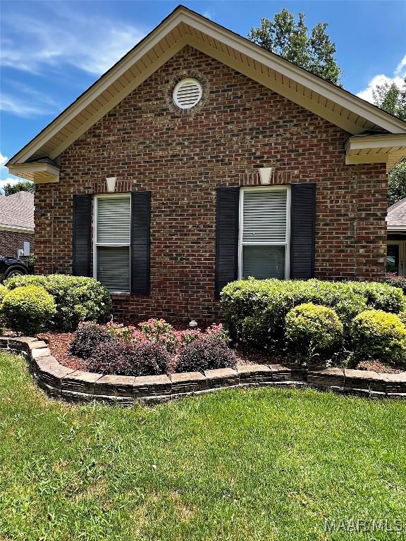 267 River Birch Cir, Wetumpka, AL 36093 - view of side of property featuring brick siding and a lawn