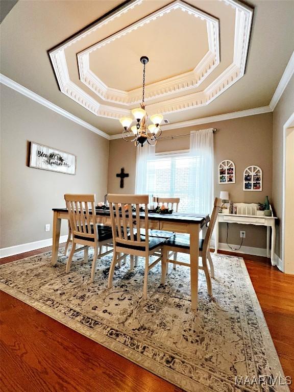 267 River Birch Cir, Wetumpka, AL 36093 - dining area with a tray ceiling, crown molding, a chandelier, and wood finished floors