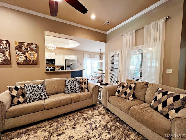 267 River Birch Cir, Wetumpka, AL 36093 - living area with crown molding, a ceiling fan, a chandelier, and recessed lighting