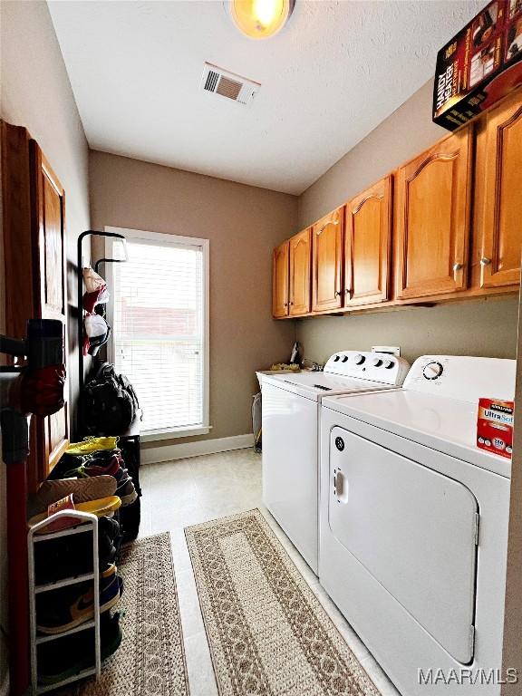 267 River Birch Cir, Wetumpka, AL 36093 - laundry room with cabinet space and washing machine and clothes dryer