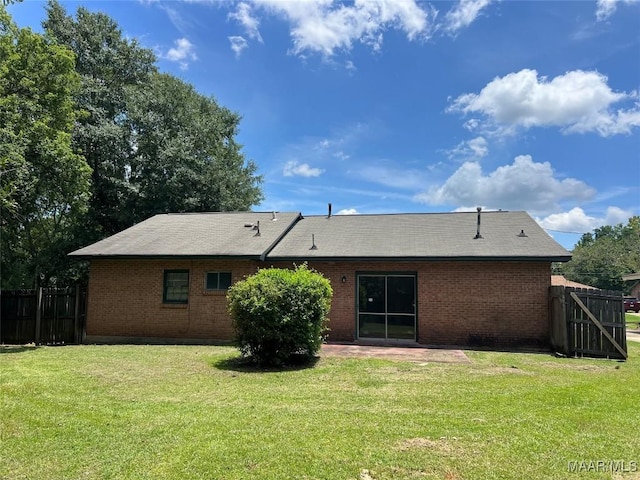 341 Sultan Ct, Montgomery, AL 36117 - back of property with brick siding, a patio, and a shingled roof