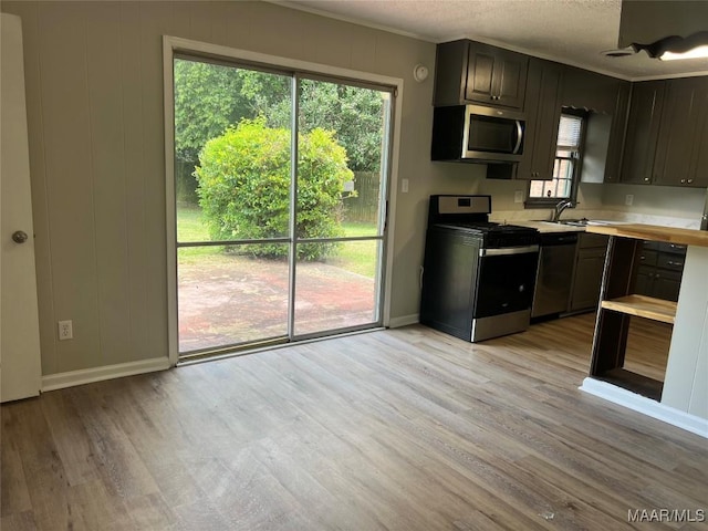 341 Sultan Ct, Montgomery, AL 36117 - kitchen with appliances with stainless steel finishes, light countertops, light wood-type flooring, and ornamental molding