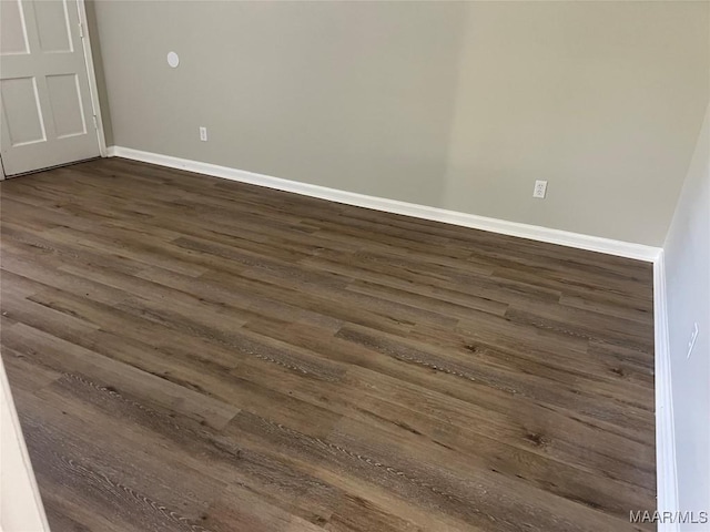 341 Sultan Ct, Montgomery, AL 36117 - unfurnished bedroom with baseboards and dark wood-style flooring