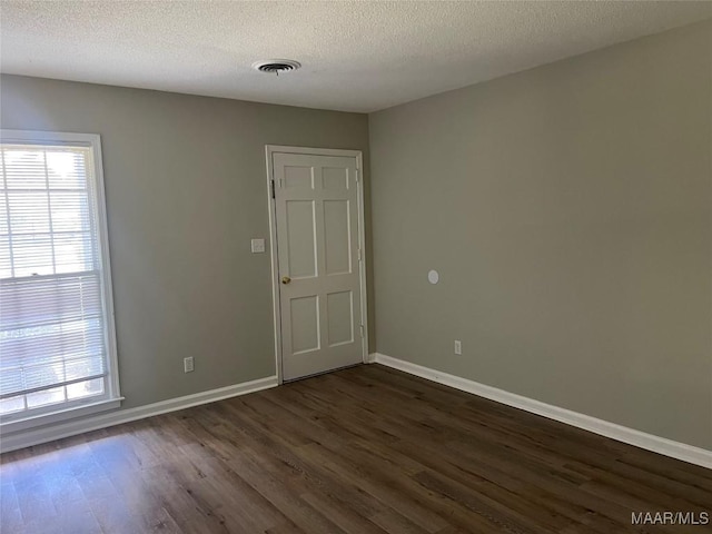 341 Sultan Ct, Montgomery, AL 36117 - empty room featuring dark wood-type flooring and a textured ceiling