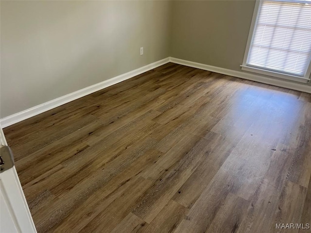 341 Sultan Ct, Montgomery, AL 36117 - spare room featuring baseboards and dark wood-type flooring