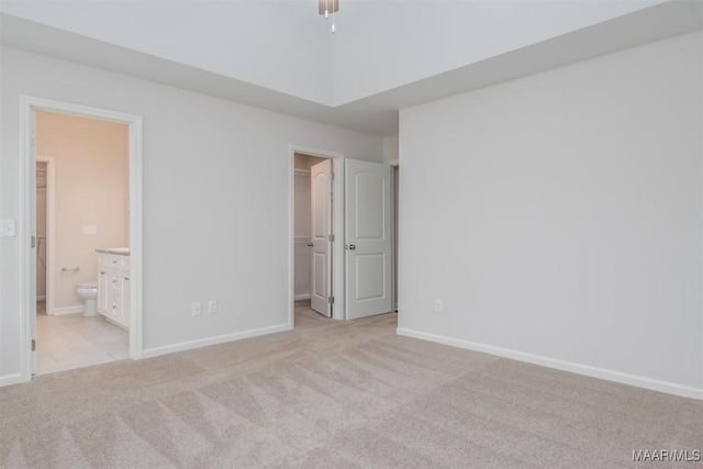 67 Gaines Ct, Wetumpka, AL 36092 - unfurnished bedroom with light carpet, a walk in closet, and ensuite bathroom