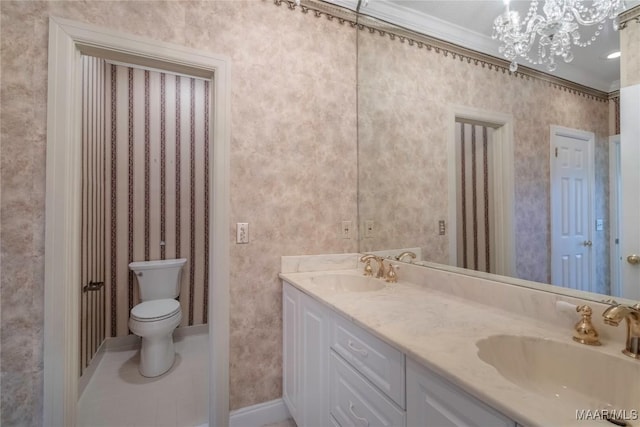 1609 Wentworth Dr, Montgomery, AL 36106 - bathroom featuring double vanity, a chandelier, and crown molding