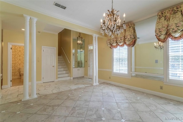 1609 Wentworth Dr, Montgomery, AL 36106 - unfurnished dining area with a chandelier, crown molding, ornate columns, and stairs