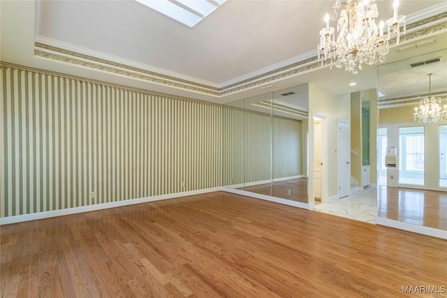 1609 Wentworth Dr, Montgomery, AL 36106 - unfurnished room featuring a chandelier, ornamental molding, and wood finished floors
