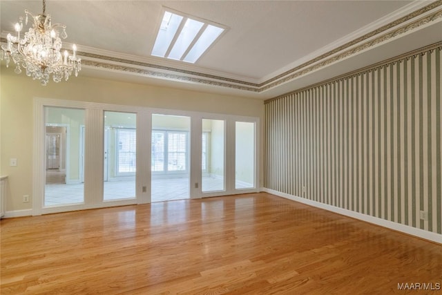 1609 Wentworth Dr, Montgomery, AL 36106 - empty room featuring ornamental molding, wood finished floors, and a chandelier