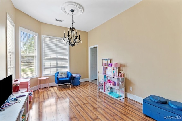 8531 Pipit Ct, Montgomery, AL 36117 - sitting room with a chandelier and wood finished floors