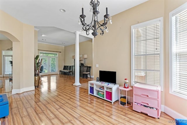 8531 Pipit Ct, Montgomery, AL 36117 - playroom featuring decorative columns, light wood finished floors, arched walkways, and ornamental molding