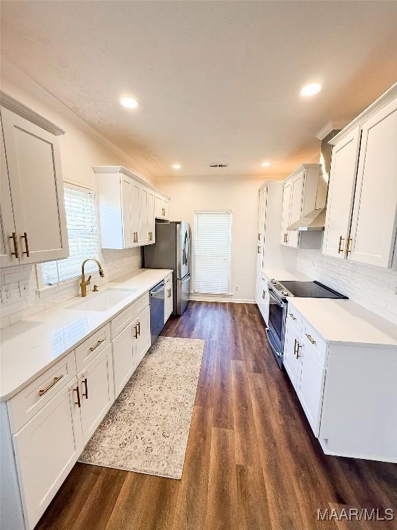 8524 Plantation Ridge Rd, Montgomery, AL 36116 - kitchen featuring stainless steel appliances, dark wood-style flooring, decorative backsplash, light countertops, and white cabinets