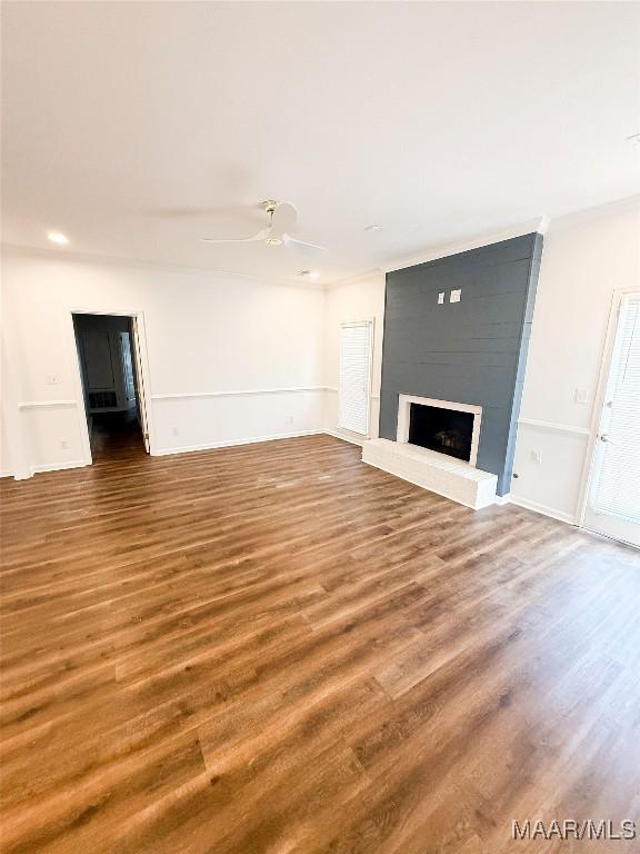 8524 Plantation Ridge Rd, Montgomery, AL 36116 - unfurnished living room featuring wood finished floors, a fireplace, ceiling fan, recessed lighting, and ornamental molding