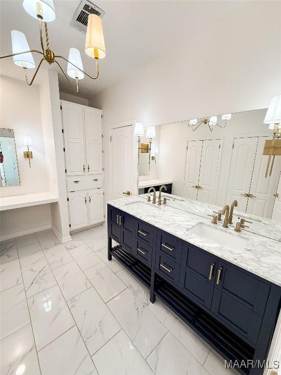 8524 Plantation Ridge Rd, Montgomery, AL 36116 - full bath featuring a chandelier, double vanity, and marble finish flooring