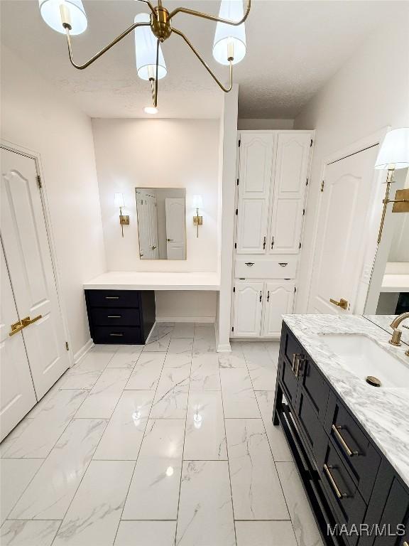 8524 Plantation Ridge Rd, Montgomery, AL 36116 - bathroom featuring marble look tile flooring and vanity