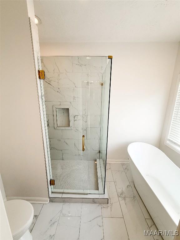 8524 Plantation Ridge Rd, Montgomery, AL 36116 - bathroom with marble finish flooring, a freestanding tub, and a marble finish shower