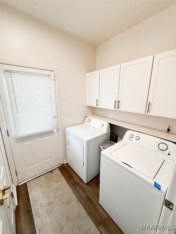8524 Plantation Ridge Rd, Montgomery, AL 36116 - laundry area featuring washing machine and dryer, cabinet space, and dark wood-style flooring