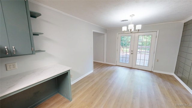 3427 Vance Ln, Montgomery, AL 36109 - unfurnished dining area with light wood finished floors, a chandelier, and ornamental molding