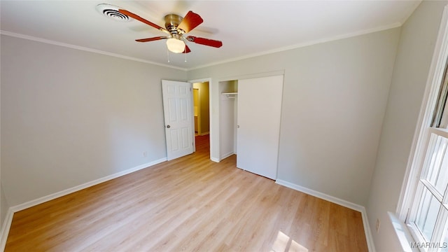 3427 Vance Ln, Montgomery, AL 36109 - unfurnished bedroom with light wood-style flooring, a closet, ornamental molding, and ceiling fan
