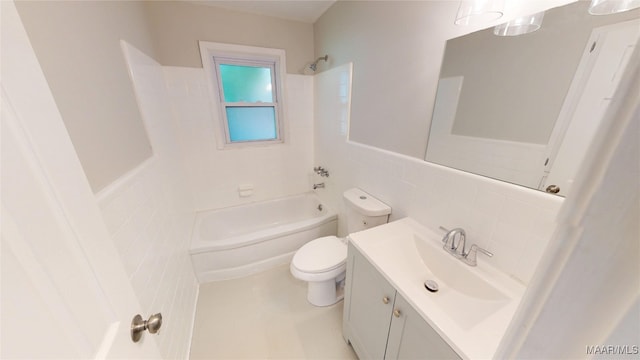 3427 Vance Ln, Montgomery, AL 36109 - bathroom featuring tile walls, shower / tub combination, and vanity