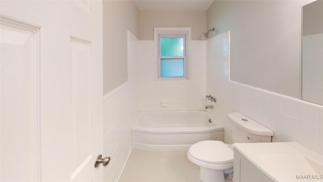 3427 Vance Ln, Montgomery, AL 36109 - bathroom featuring tile walls, vanity, bathing tub / shower combination, and wainscoting
