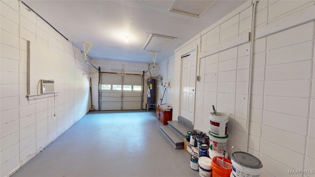 3427 Vance Ln, Montgomery, AL 36109 - garage featuring water heater and an AC wall unit