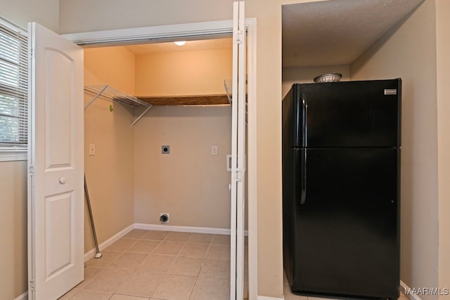 2014 Commodore St, Montgomery, AL 36106 - laundry room featuring hookup for an electric dryer and light tile patterned floors