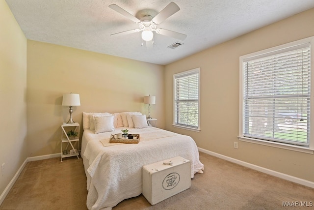 2014 Commodore St, Montgomery, AL 36106 - bedroom featuring light carpet, a textured ceiling, and ceiling fan