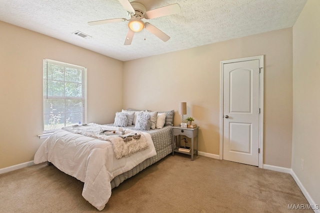2014 Commodore St, Montgomery, AL 36106 - bedroom with a textured ceiling, light carpet, and a ceiling fan
