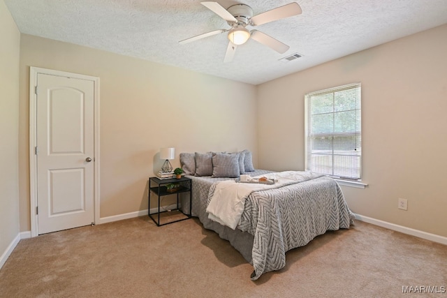 2014 Commodore St, Montgomery, AL 36106 - bedroom featuring light carpet, a textured ceiling, and ceiling fan