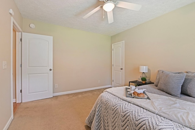 2014 Commodore St, Montgomery, AL 36106 - bedroom with a textured ceiling, light colored carpet, and ceiling fan