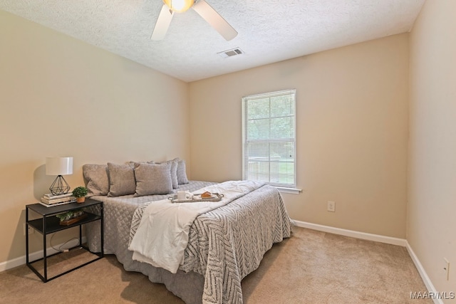 2014 Commodore St, Montgomery, AL 36106 - bedroom with light colored carpet, a textured ceiling, and ceiling fan