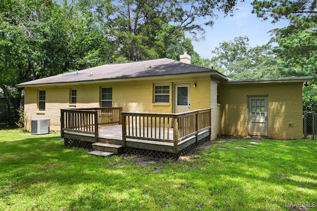 2014 Commodore St, Montgomery, AL 36106 - rear view of house with brick siding, a chimney, a yard, and a wooden deck