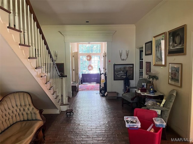 1682 Landline Rd, Selma, AL 36701 - foyer featuring brick floors, stairs, and ornamental molding