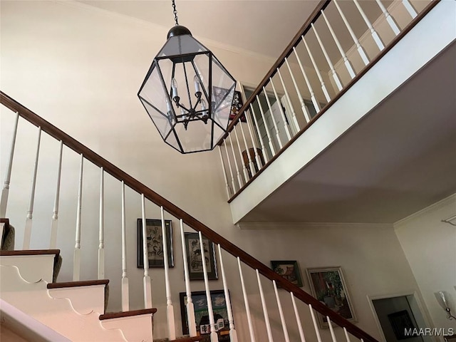 1682 Landline Rd, Selma, AL 36701 - stairs with a towering ceiling, crown molding, and a chandelier