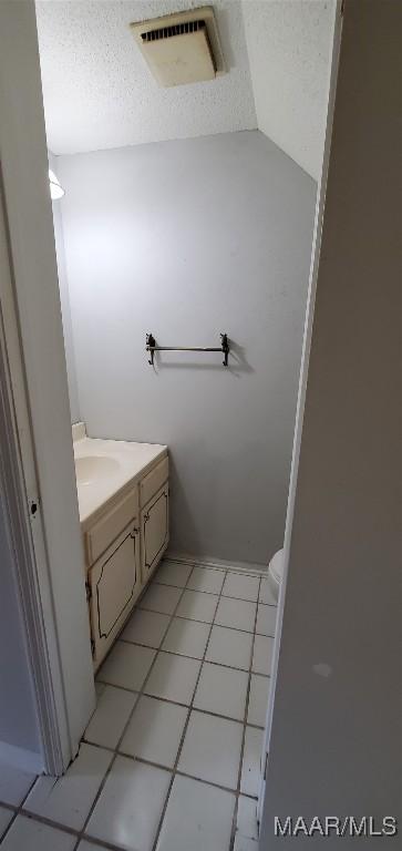 3152 Gentilly Ct, Montgomery, AL 36116 - bathroom with vanity, a textured ceiling, and tile patterned flooring
