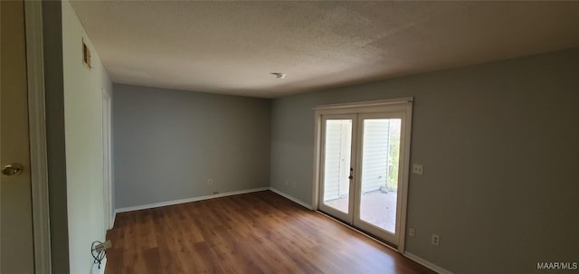 3152 Gentilly Ct, Montgomery, AL 36116 - unfurnished room with healthy amount of natural light, wood finished floors, and a textured ceiling