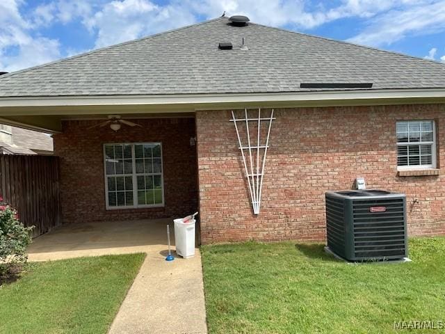 8824 Templeton Ct, Montgomery, AL 36117 - back of property featuring roof with shingles, brick siding, a ceiling fan, a yard, and a patio