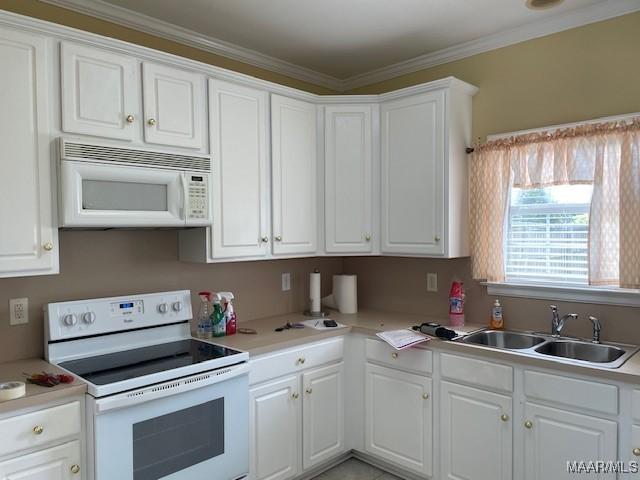8824 Templeton Ct, Montgomery, AL 36117 - kitchen featuring white appliances, white cabinetry, light countertops, and ornamental molding