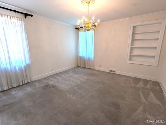 1672 Gilmer Ave, Montgomery, AL 36104 - carpeted empty room with a chandelier, built in features, and crown molding