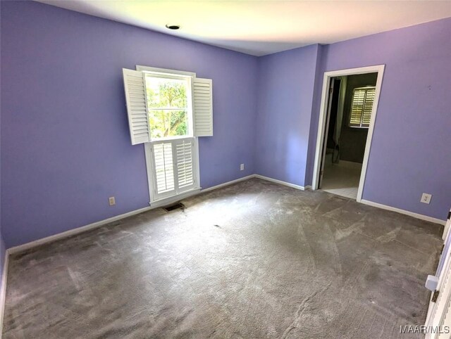 1672 Gilmer Ave, Montgomery, AL 36104 - spare room featuring plenty of natural light and carpet flooring