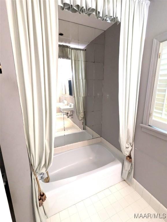 1672 Gilmer Ave, Montgomery, AL 36104 - bathroom featuring shower / bath combination with curtain and tile patterned flooring