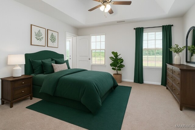 75 Gaines Ct, Wetumpka, AL 36092 - bedroom featuring light colored carpet, a tray ceiling, and a ceiling fan
