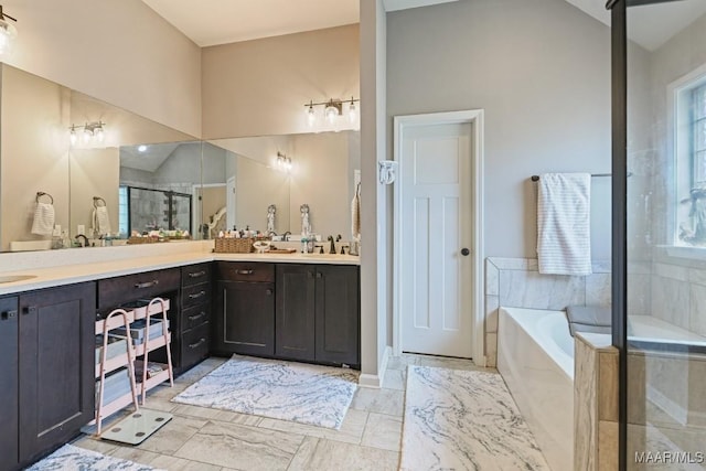 905 Overture Dr, Montgomery, AL 36117 - bathroom featuring plenty of natural light, a bath, vanity, and vaulted ceiling