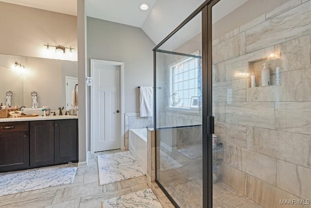 905 Overture Dr, Montgomery, AL 36117 - full bathroom with vanity, a garden tub, a stall shower, and lofted ceiling