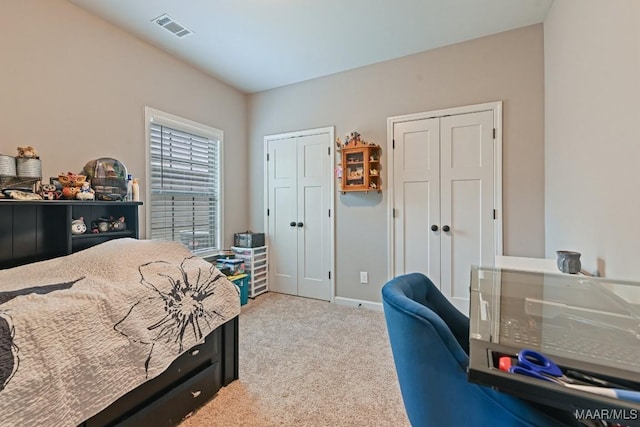 905 Overture Dr, Montgomery, AL 36117 - carpeted bedroom featuring two closets and baseboards